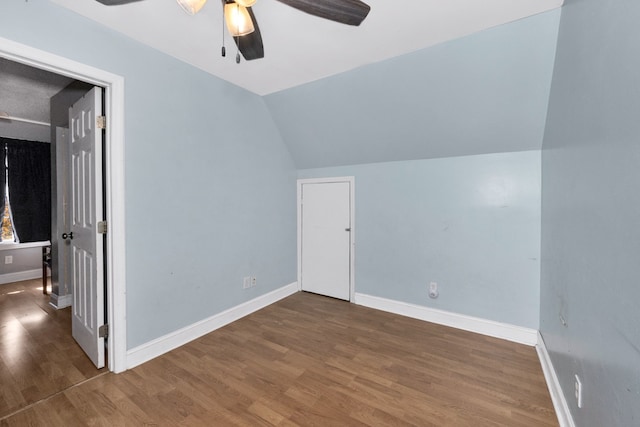 bonus room with vaulted ceiling, wood-type flooring, and ceiling fan