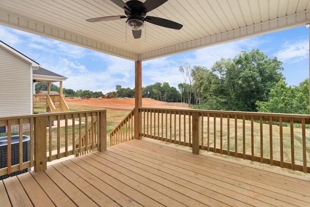 wooden deck with ceiling fan, central AC, and stairway