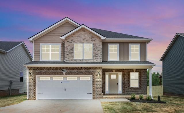 view of front of house featuring a garage and covered porch