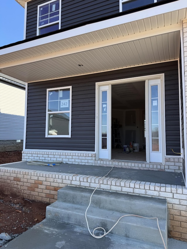 doorway to property with a porch