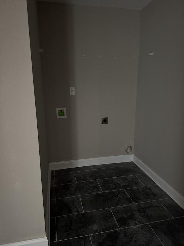 laundry area with laundry area, electric dryer hookup, and baseboards