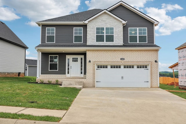 242 Cardinal Crk, Clarksville, TN 37040 - craftsman inspired home featuring driveway, brick siding, fence, a front lawn, and an attached garage