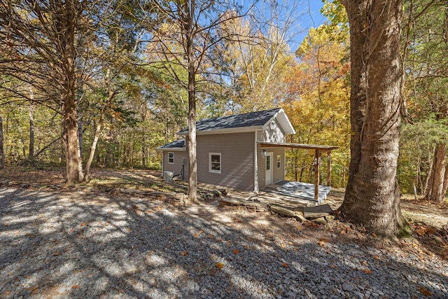 view of home's exterior featuring a wooden deck