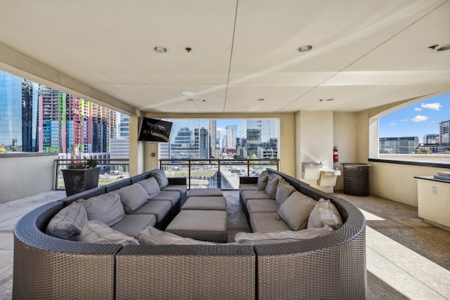 view of patio featuring a balcony and an outdoor hangout area