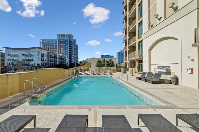 view of swimming pool featuring a patio area and pool water feature