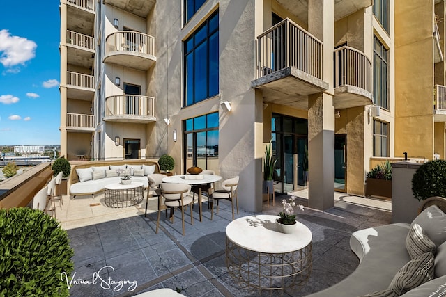 view of patio / terrace featuring an outdoor hangout area and a balcony