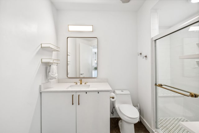 bathroom with vanity, toilet, and an enclosed shower