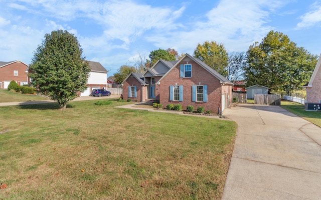 view of front of property featuring a garage and a front lawn