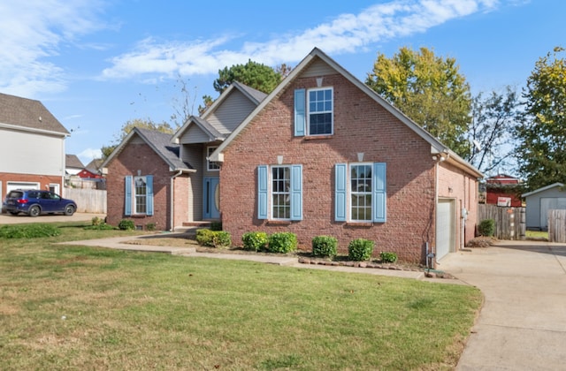 view of front of home featuring a front yard and a garage