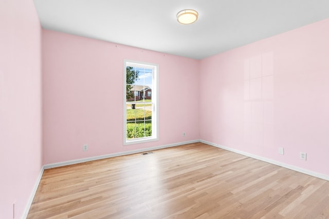 unfurnished room featuring light wood-type flooring