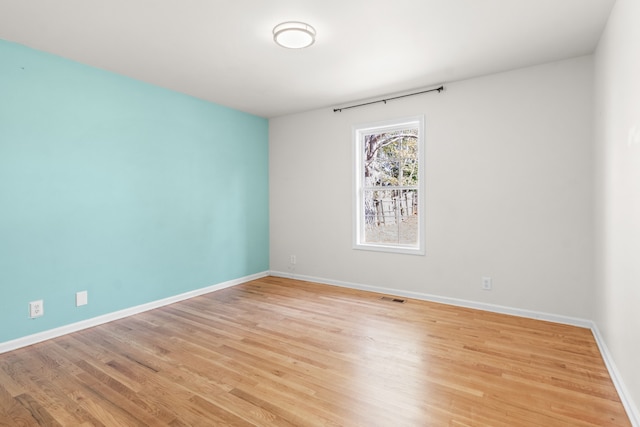 unfurnished room featuring light hardwood / wood-style flooring