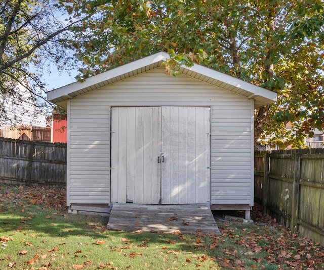 view of outbuilding featuring a yard