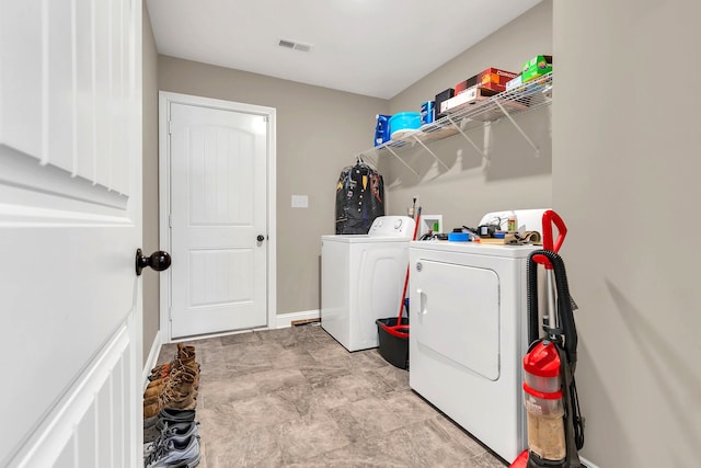 laundry area with washing machine and dryer