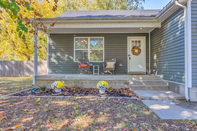 entrance to property featuring a porch