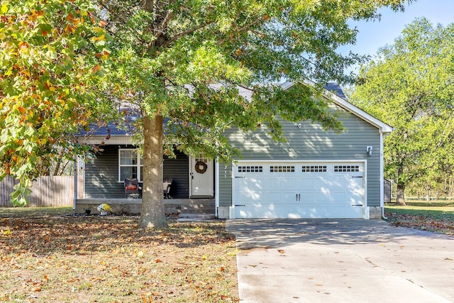 view of front of house featuring a garage and covered porch