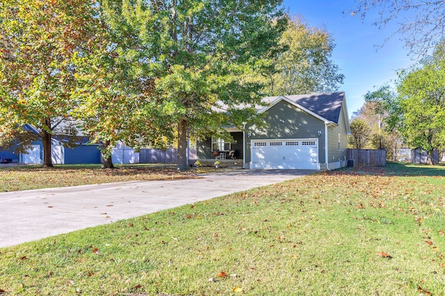 view of front of home featuring a front lawn and a garage