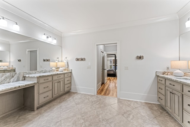 bathroom featuring vanity, ornamental molding, and tile patterned floors