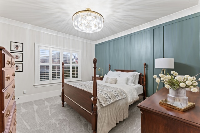 carpeted bedroom featuring a notable chandelier and ornamental molding