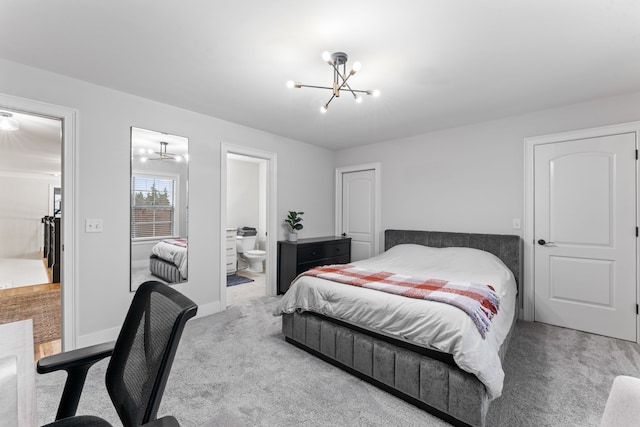 bedroom featuring carpet and ensuite bathroom