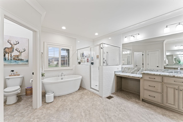 full bathroom featuring independent shower and bath, toilet, tile patterned floors, vanity, and crown molding