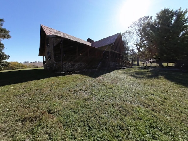 view of home's exterior with a lawn