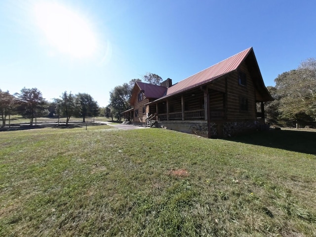 view of side of home featuring a lawn