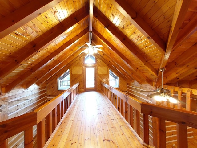 bonus room featuring light hardwood / wood-style floors, vaulted ceiling with beams, and wooden ceiling