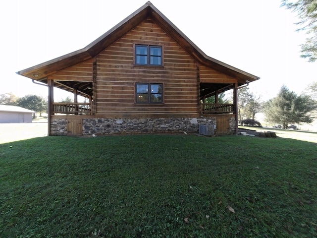 view of property exterior with central AC, a lawn, and a garage