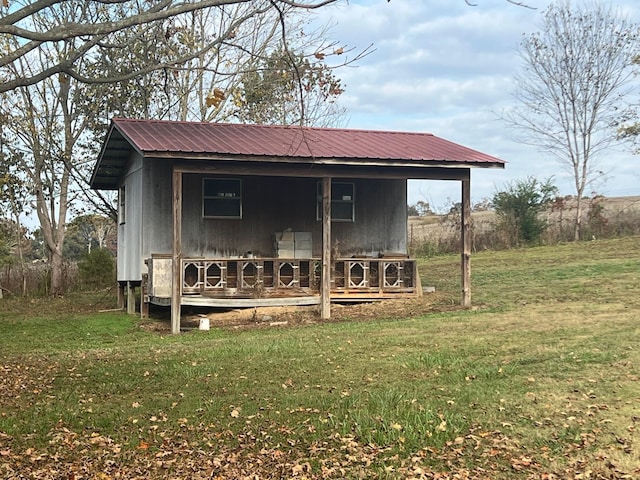 view of outdoor structure featuring a lawn