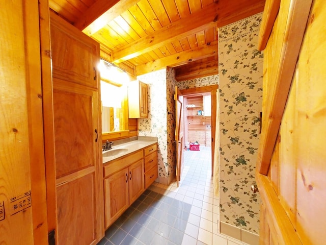 bathroom with vanity, wood ceiling, beam ceiling, and tile patterned flooring