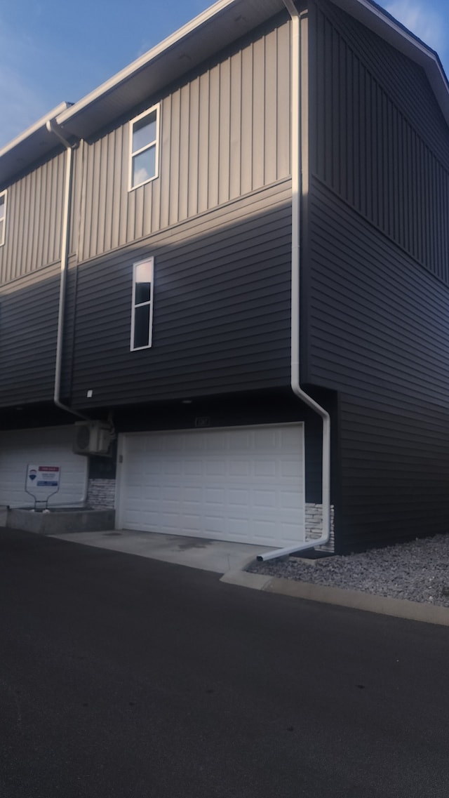 view of side of home with a garage