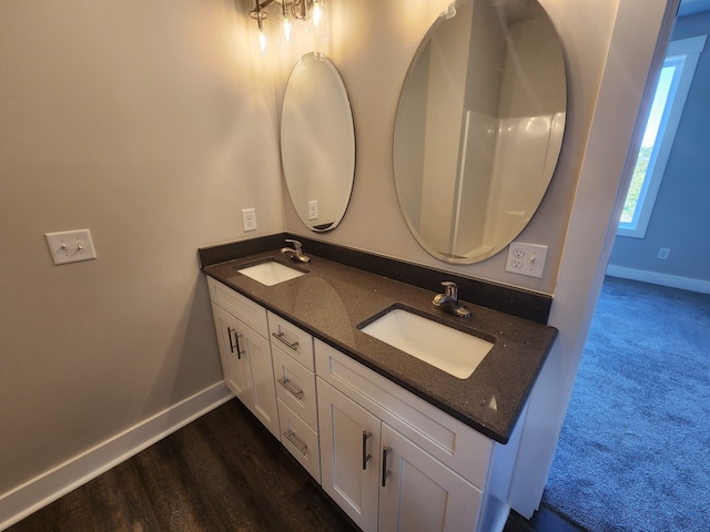 bathroom with vanity and wood-type flooring