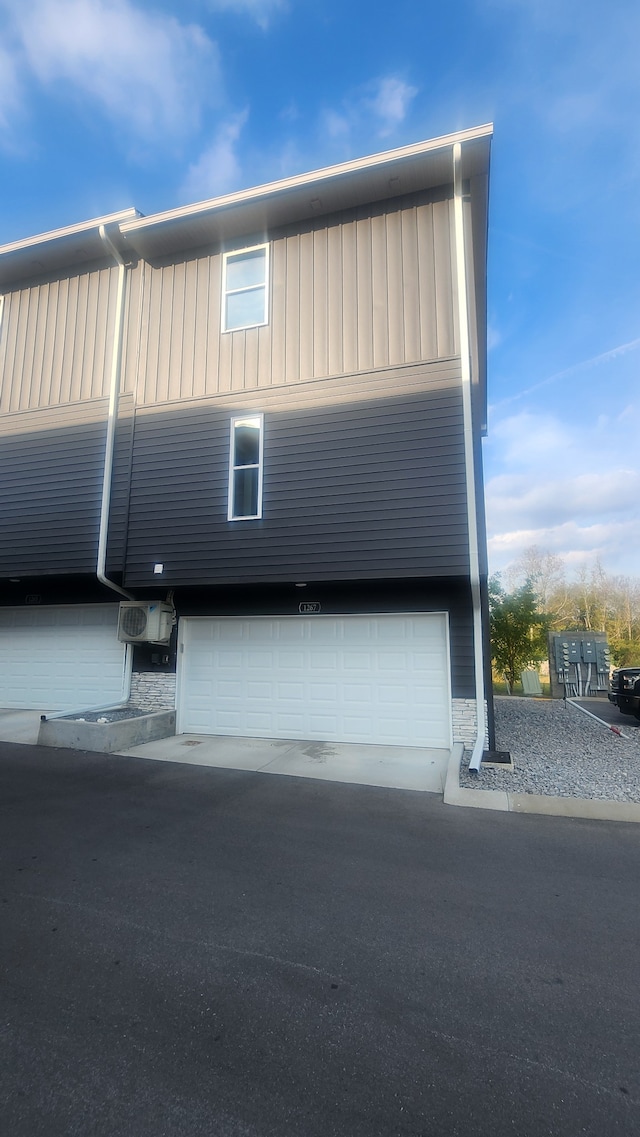 view of side of property with a garage