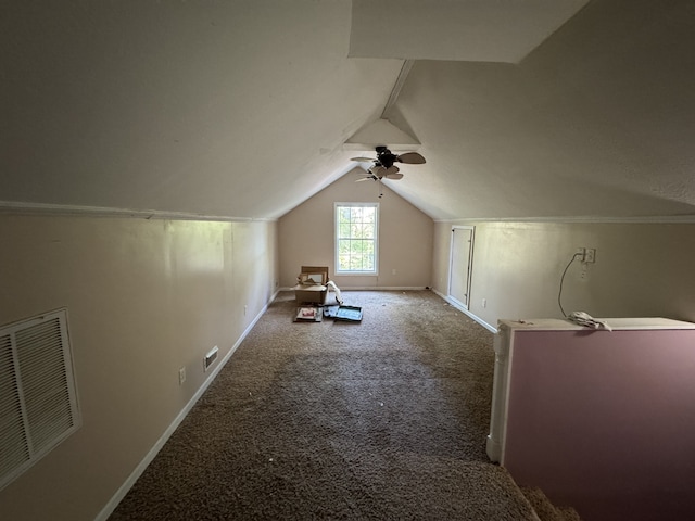 additional living space featuring ceiling fan, carpet, and vaulted ceiling