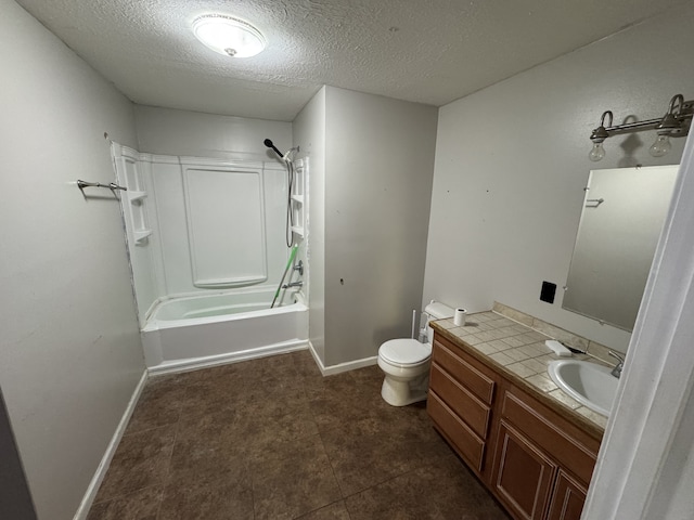 full bathroom featuring vanity, toilet, a textured ceiling, and  shower combination