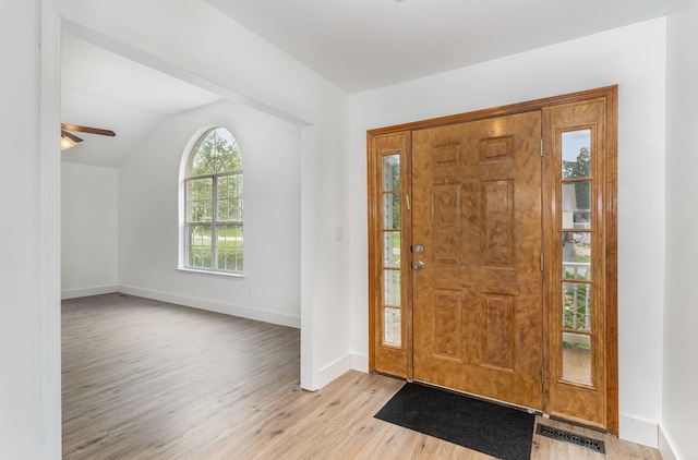 foyer featuring vaulted ceiling, light hardwood / wood-style floors, and ceiling fan