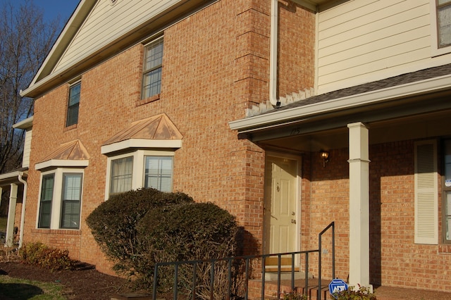 view of property exterior featuring covered porch