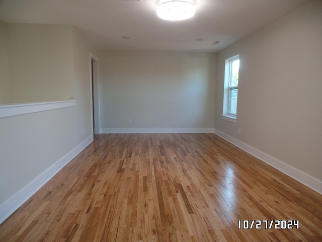 empty room with light hardwood / wood-style floors