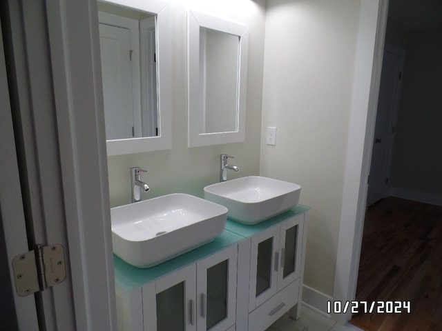 bathroom featuring vanity and wood-type flooring