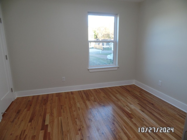 empty room featuring wood-type flooring