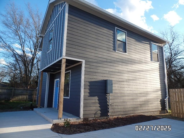 view of home's exterior featuring fence