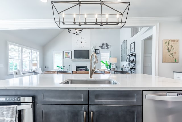 kitchen featuring dishwasher, an inviting chandelier, crown molding, and sink