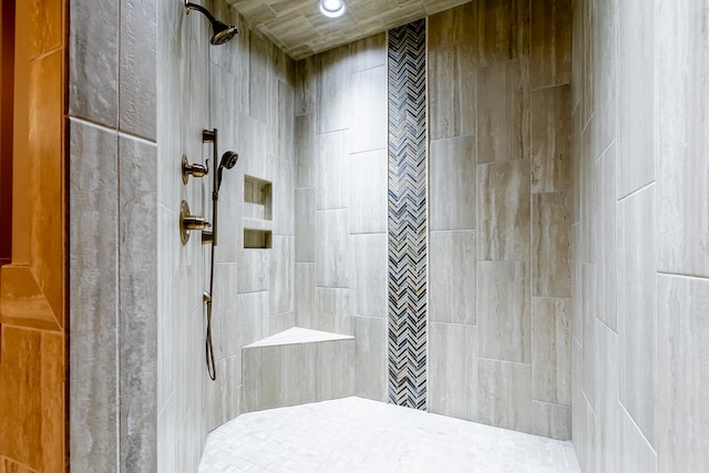 bathroom with tiled shower