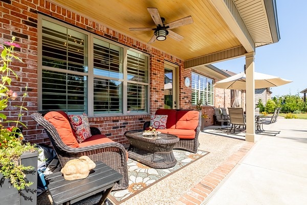 view of patio / terrace featuring ceiling fan and an outdoor living space