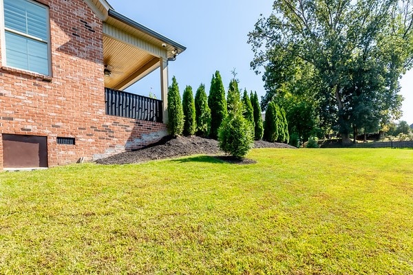 view of yard featuring a balcony