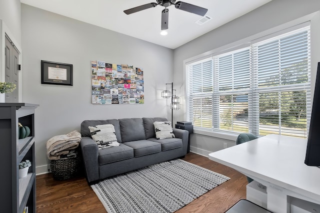 living room featuring dark hardwood / wood-style floors and ceiling fan