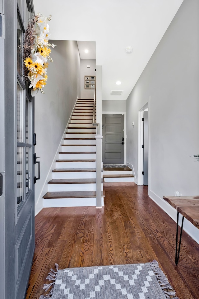 foyer with dark hardwood / wood-style floors