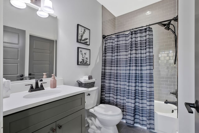 full bathroom featuring shower / bath combo with shower curtain, vanity, toilet, and tile patterned floors