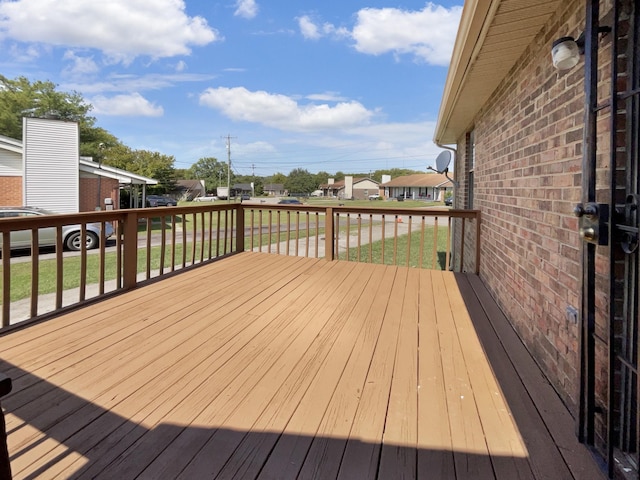 wooden terrace with a yard