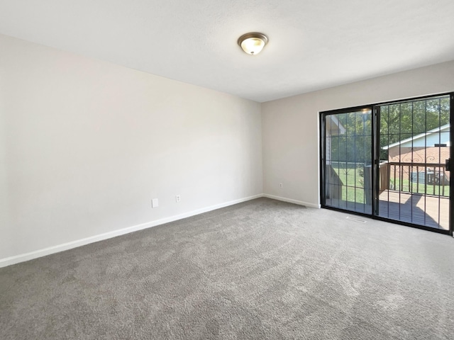 empty room with carpet flooring